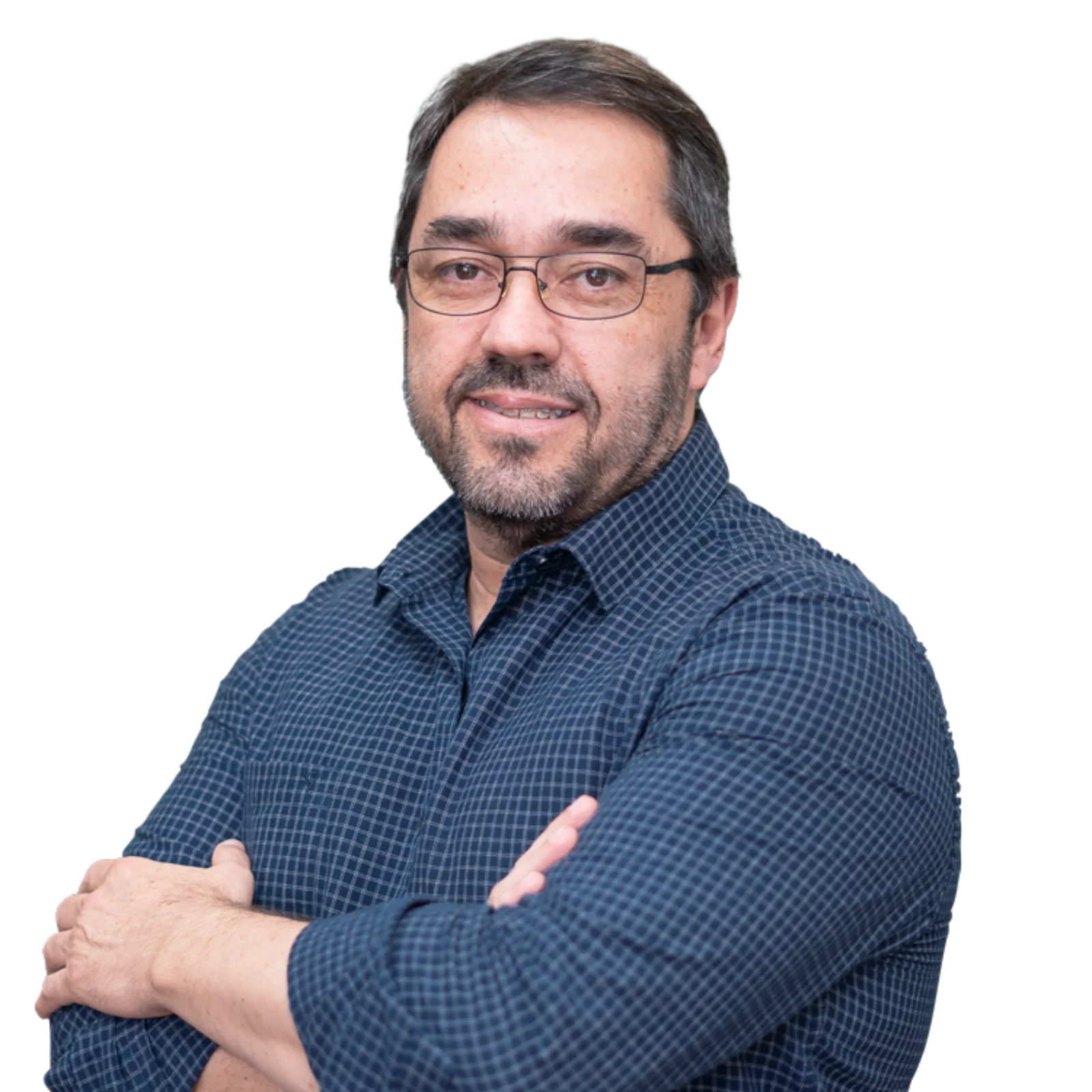 Professional portrait of Carlos Mattos wearing glasses and a checkered shirt.