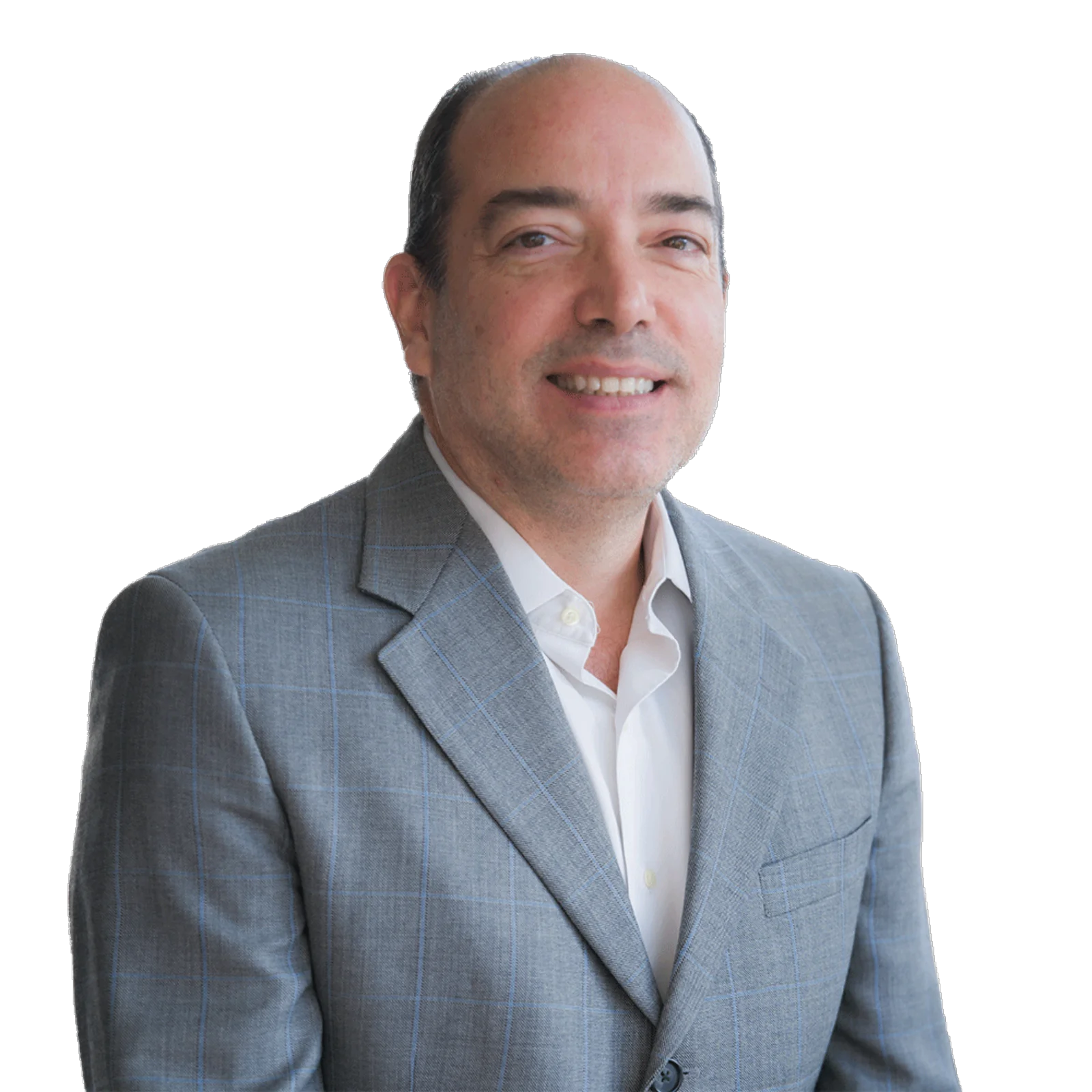 Portrait of Alfredo Neves wearing a light grey checked suit and white shirt, smiling warmly.