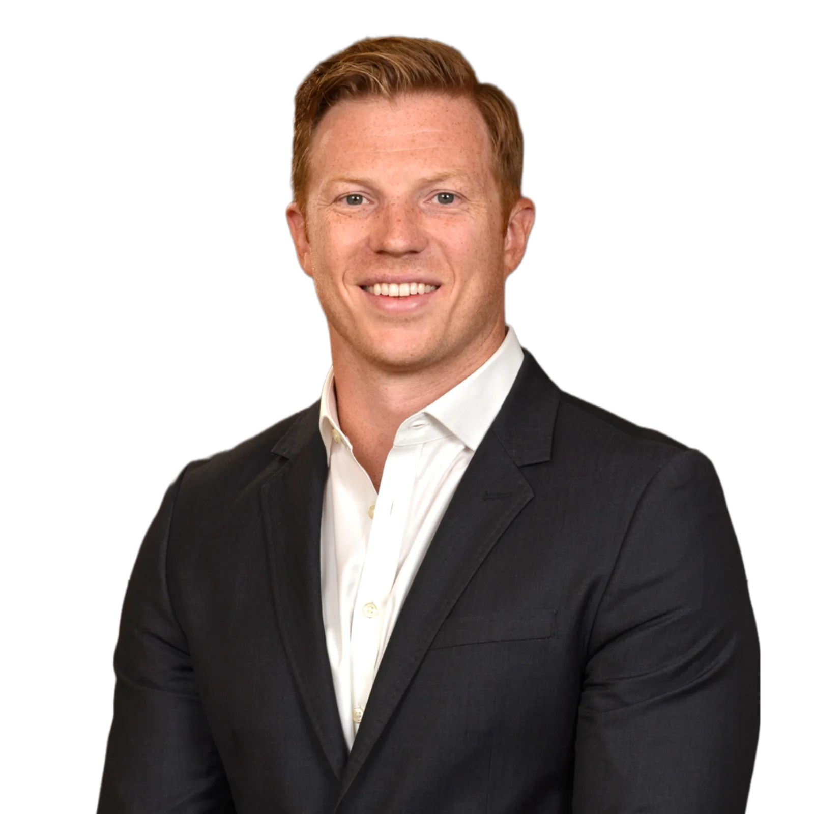 Portrait of Brandon Speweik wearing a dark blazer and white shirt, smiling confidently.