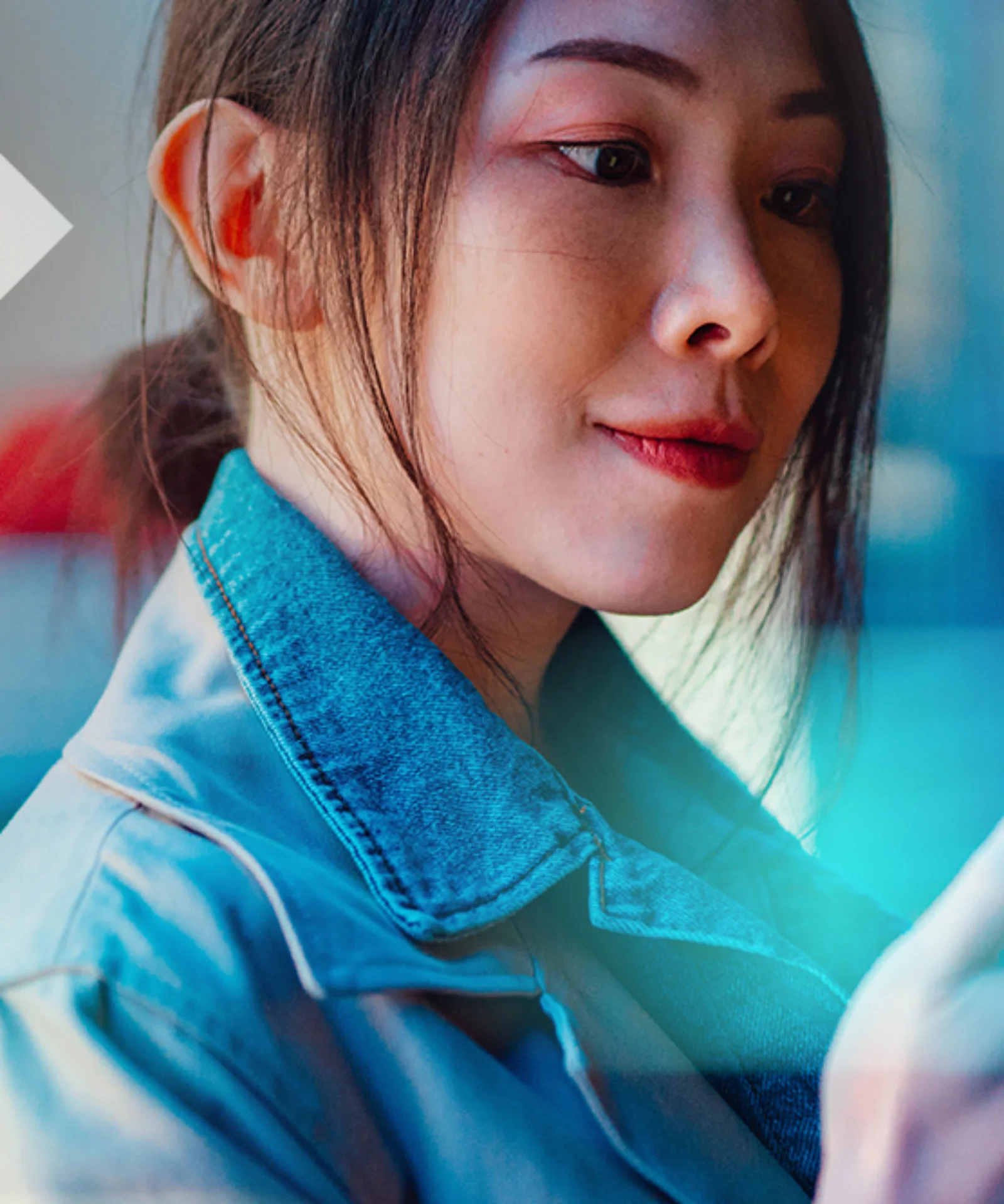 A woman using her smartphone, symbolizing the seamless integration and interoperability of digital payment systems in the regulated financial ecosystem.