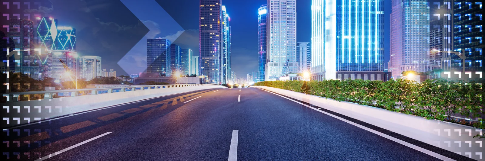 Empty urban road leading into a cityscape with brightly lit skyscrapers at night, symbolizing innovation and the future of urban development.