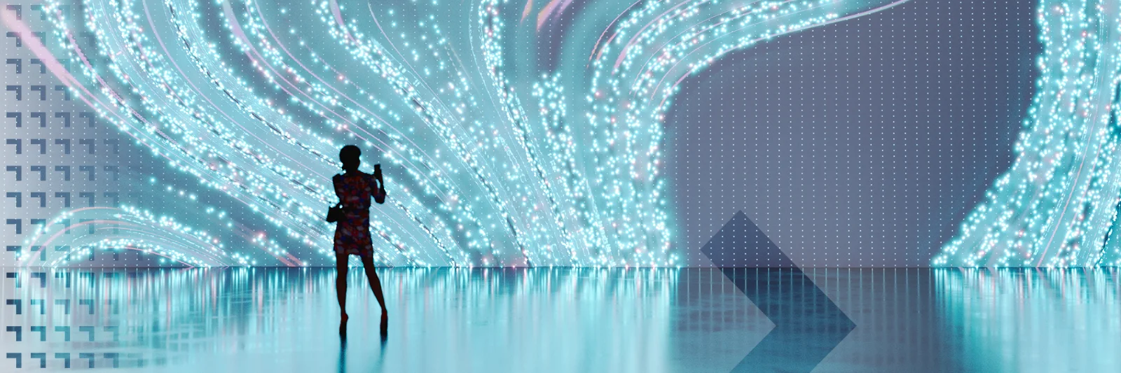 Silhouette of a person standing before a large, flowing digital light display, representing the interaction between humans and advanced digital technology.