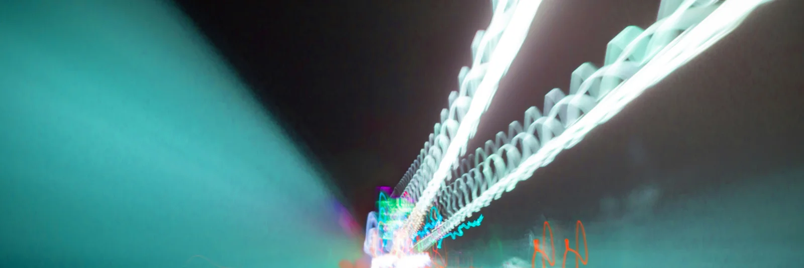 Abstract image depicting light trails in a tunnel, symbolising speed and connectivity