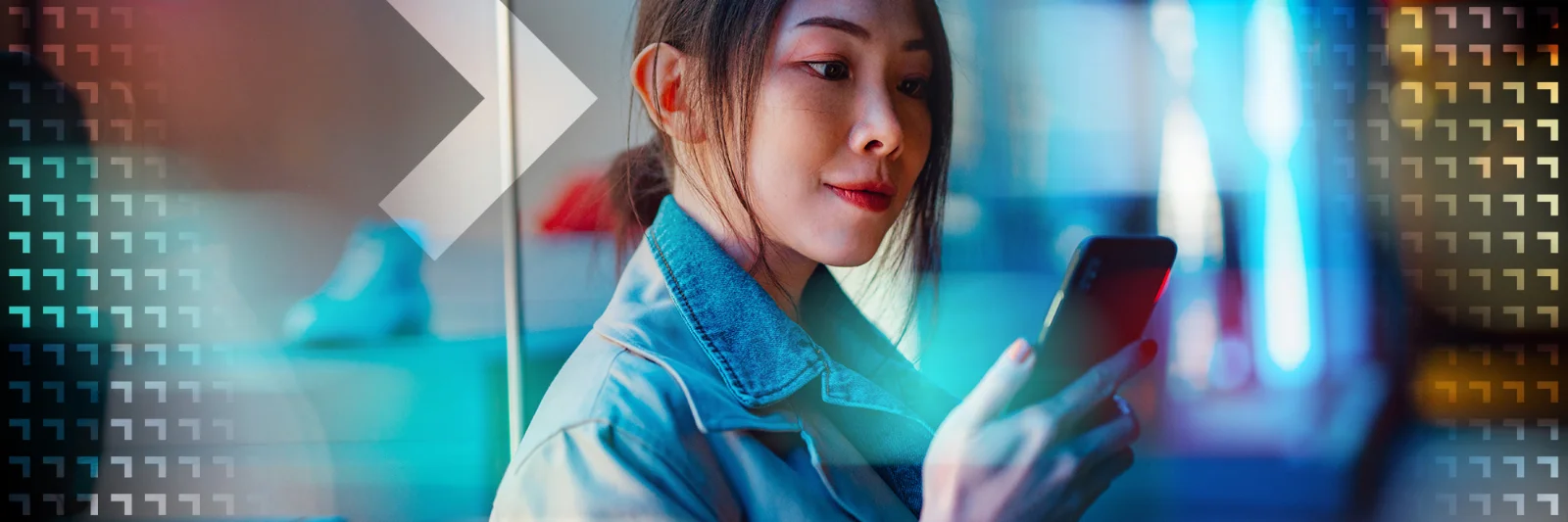 A woman using her smartphone, symbolizing the seamless integration and interoperability of digital payment systems in the regulated financial ecosystem.