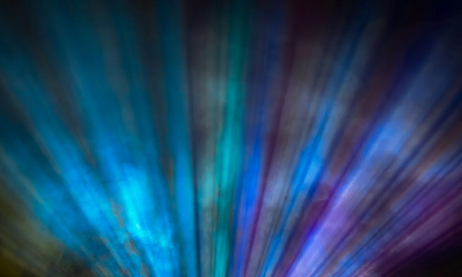 Abstract blue and purple light streaks, creating a dynamic and vibrant visual effect, symbolizing the innovative and complex nature of the Smaragd Compliance Suite.