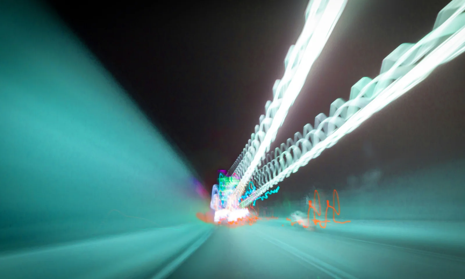 Abstract image depicting light trails in a tunnel, symbolising speed and connectivity