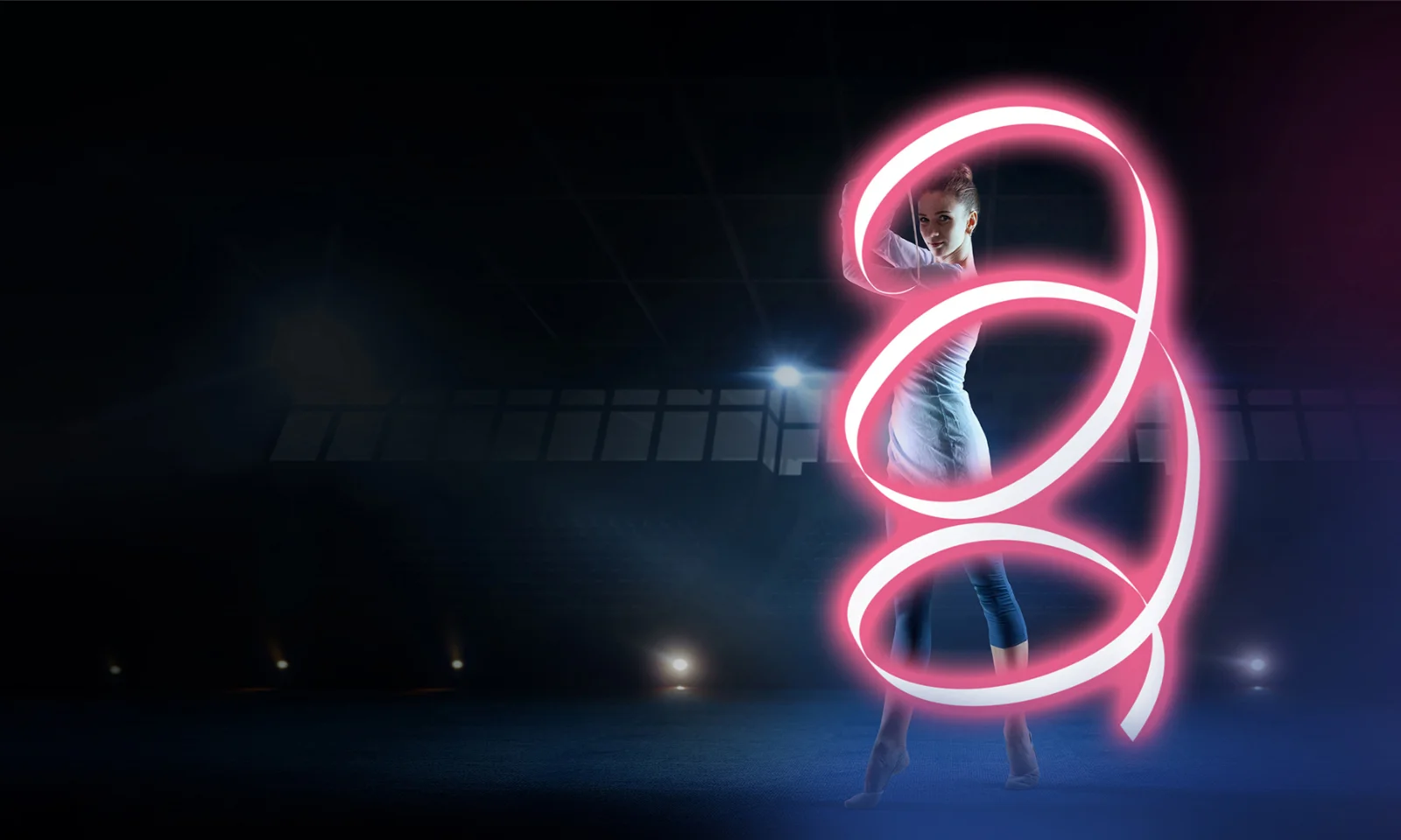 A dynamic key visual for the Core Talks event featuring a dancer performing in a dark, illuminated arena with a glowing pink ribbon forming a captivating, swirling pattern around them.