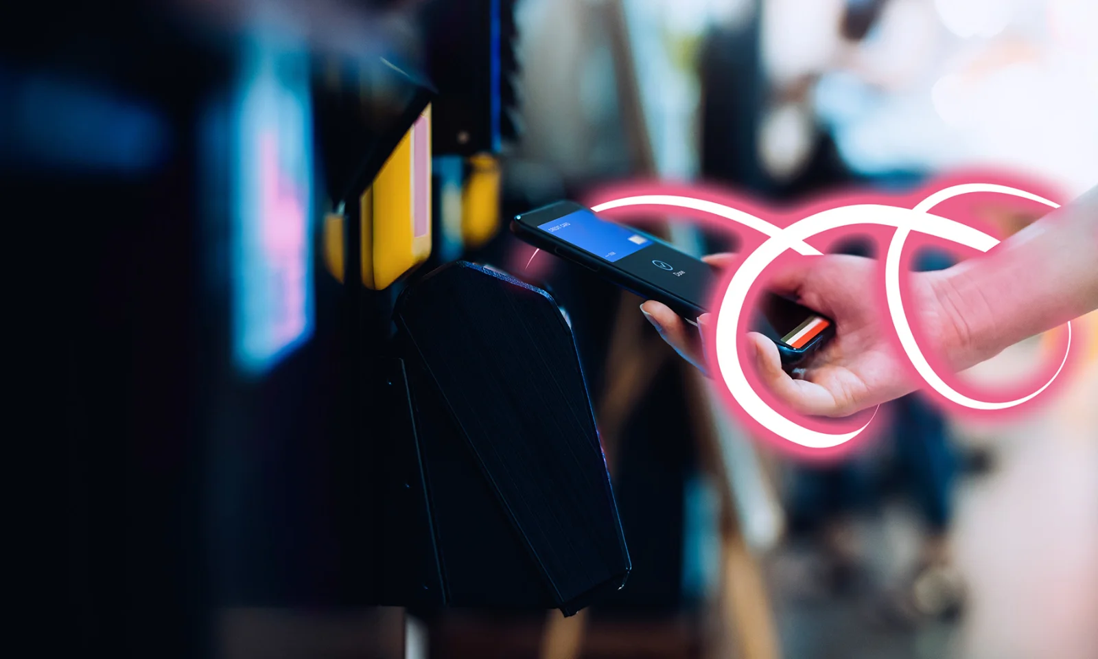 Hand holding a smartphone making a contactless payment with a glowing pink ribbon accent.