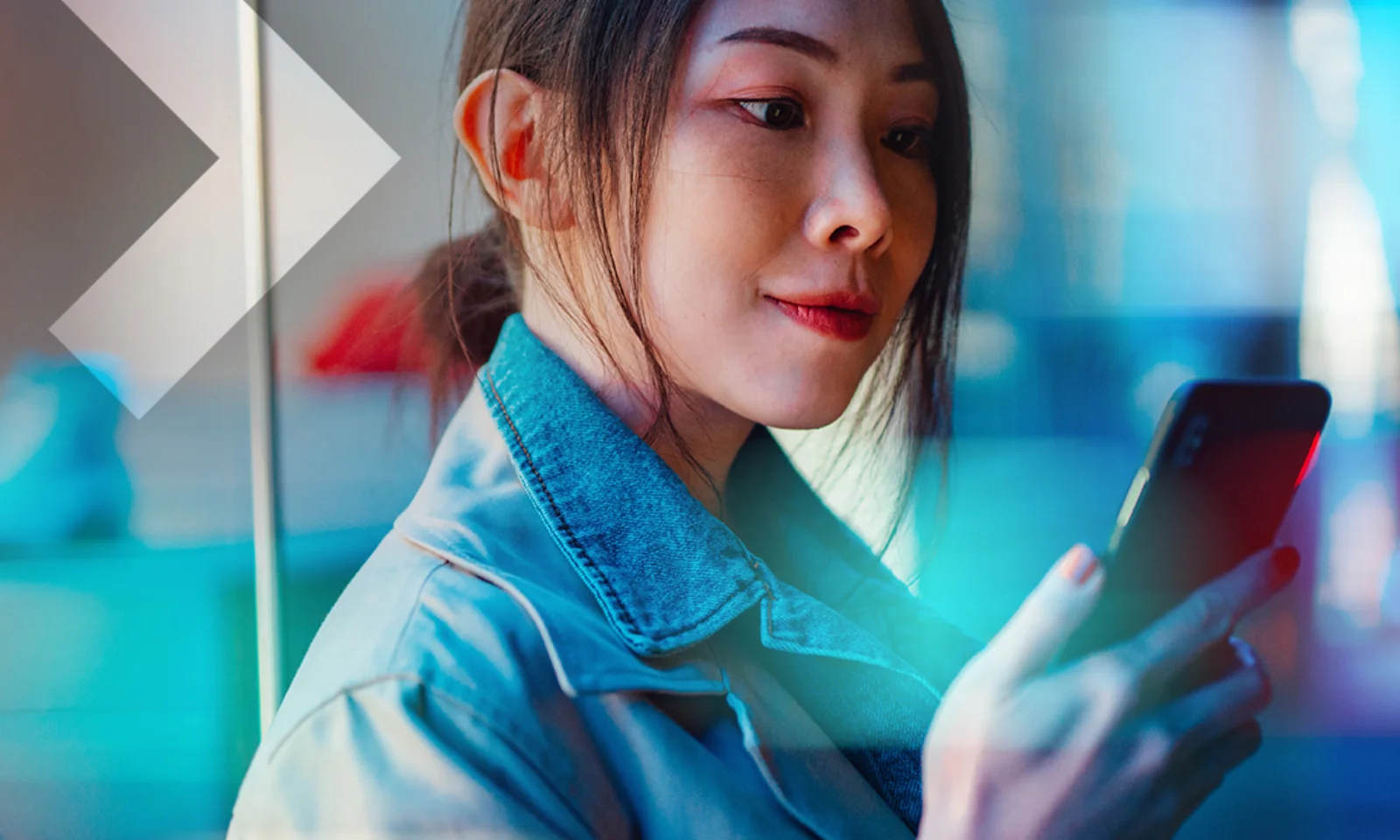 A woman using her smartphone, symbolizing the seamless integration and interoperability of digital payment systems in the regulated financial ecosystem.